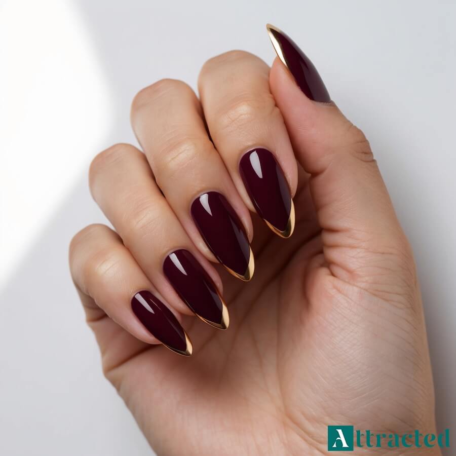 Paznokcie ciemnoczerwone ze złotym french