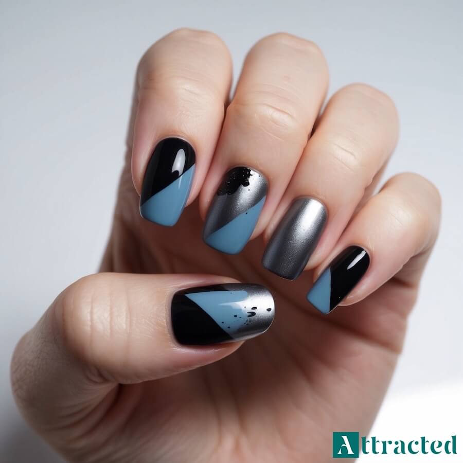 Czarny manicure z metalicznym połyskiem i brokatem